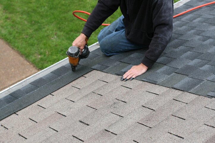 A Shingle roof is being repaired in Gresham, OR