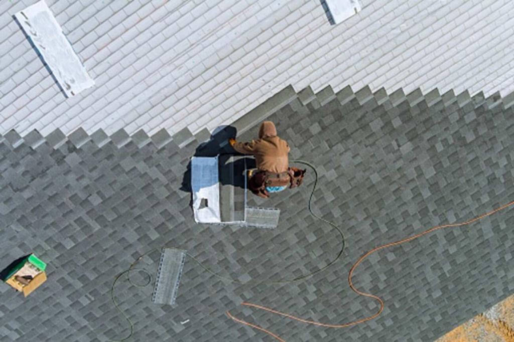 A shingle roof is getting repaired in Gresham, OR